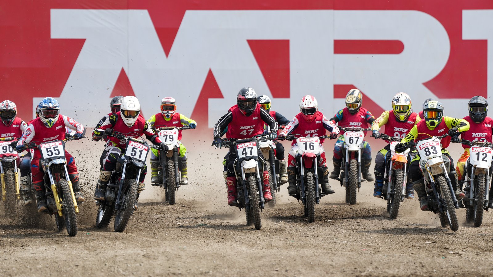 Motocross riders off the start gate