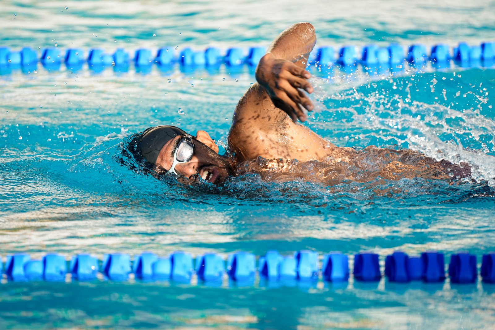 Swimmer mid-stroke, freestyle lane